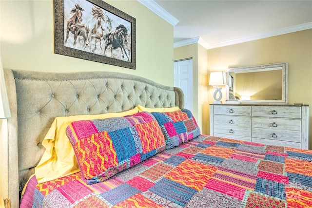 bedroom with a closet and ornamental molding