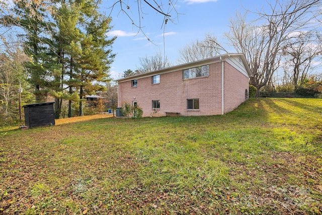 rear view of property with a yard