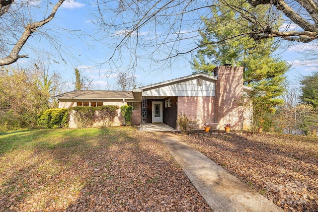 ranch-style house with a front lawn