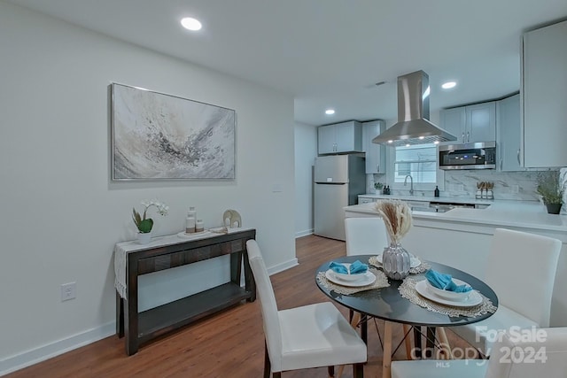 dining room featuring light hardwood / wood-style floors and sink