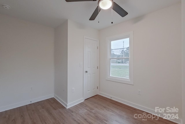 empty room featuring ceiling fan and light wood-type flooring