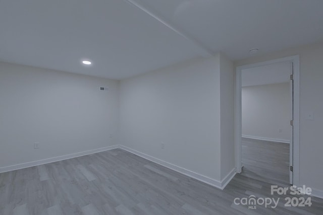 spare room featuring light hardwood / wood-style flooring