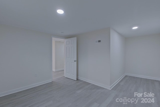 spare room with light wood-type flooring