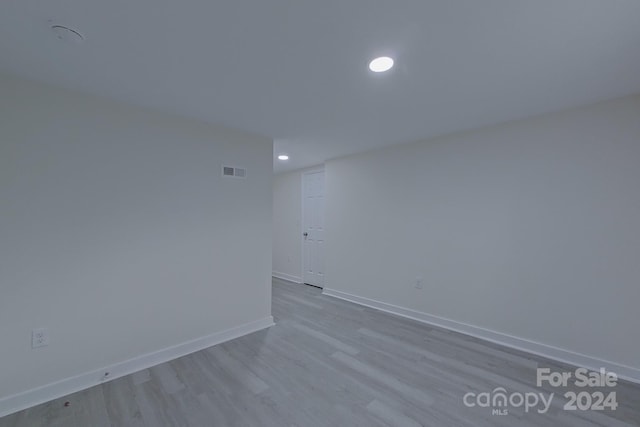 unfurnished room featuring light hardwood / wood-style flooring