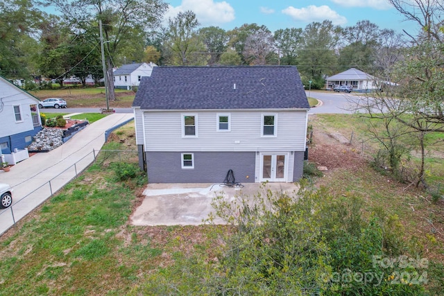 rear view of property featuring a patio area and french doors