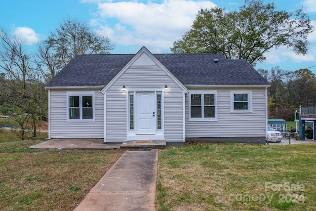 bungalow with a front yard