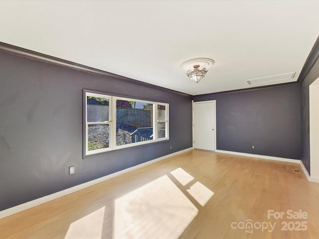 spare room featuring light hardwood / wood-style floors