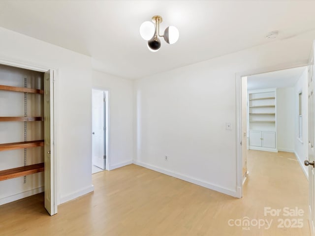 unfurnished bedroom with hardwood / wood-style flooring