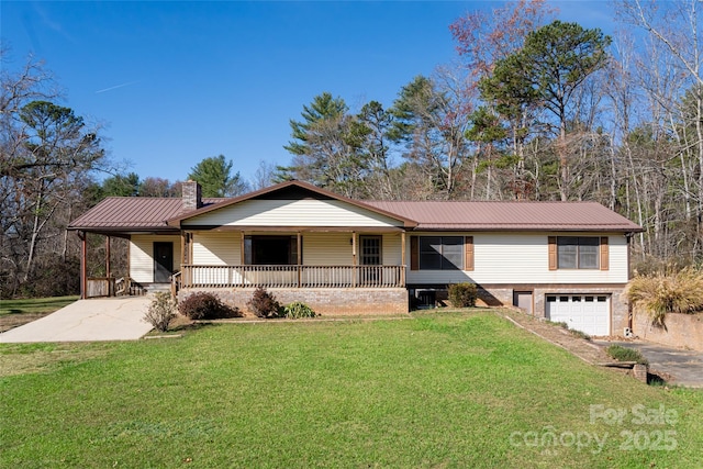 261 Lower Christ School Rd, Fletcher, NC 28732 - single story home featuring a porch, concrete driveway, an attached garage, and a front lawn