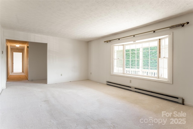 261 Lower Christ School Rd, Fletcher, NC 28732 - carpeted empty room featuring a baseboard heating unit and a textured ceiling