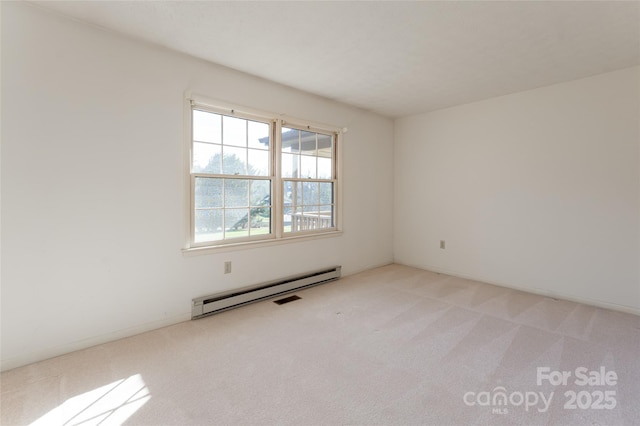 261 Lower Christ School Rd, Fletcher, NC 28732 - empty room with a baseboard heating unit and light carpet