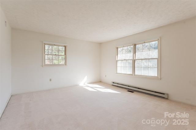 261 Lower Christ School Rd, Fletcher, NC 28732 - empty room featuring baseboard heating, carpet flooring, and a textured ceiling