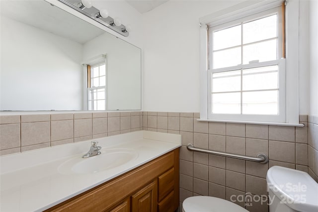 261 Lower Christ School Rd, Fletcher, NC 28732 - half bath featuring tile walls, toilet, vanity, and a wainscoted wall