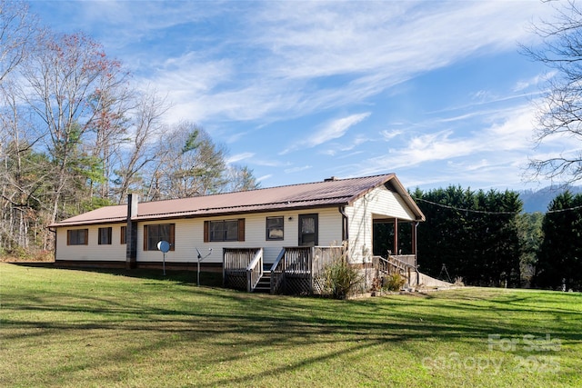 261 Lower Christ School Rd, Fletcher, NC 28732 - back of house with a yard, metal roof, and a wooden deck