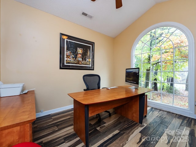 home office featuring dark wood-type flooring, ceiling fan, and lofted ceiling