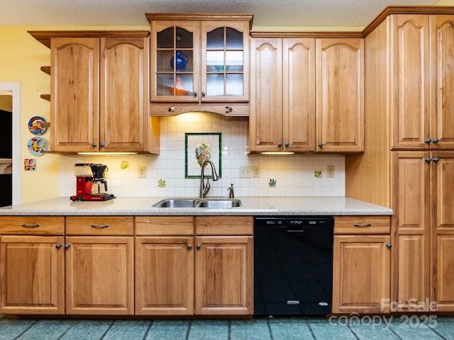 kitchen with black dishwasher, sink, and decorative backsplash