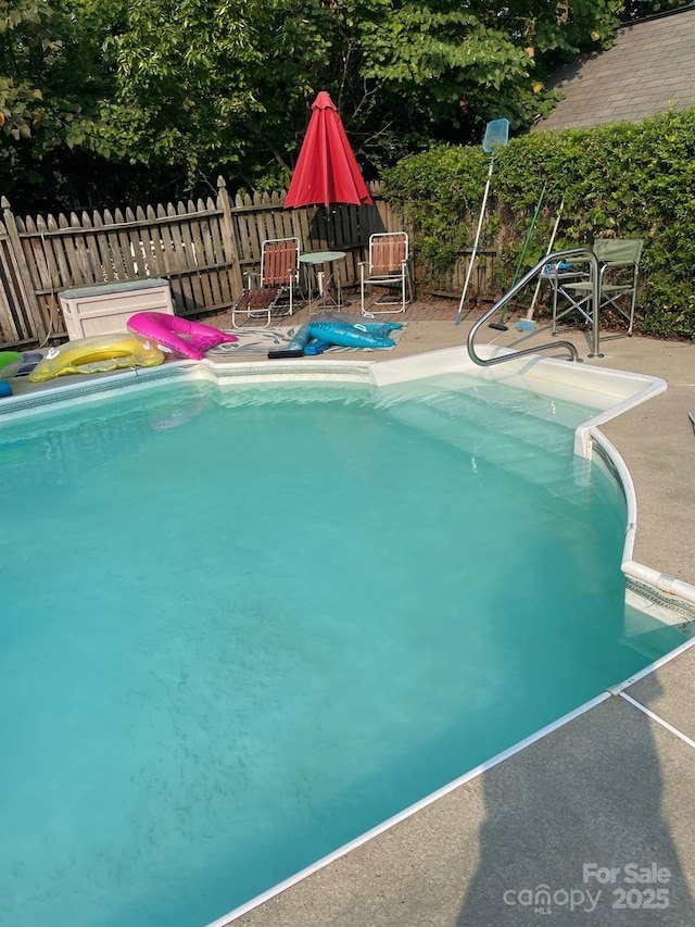 view of pool featuring a patio area