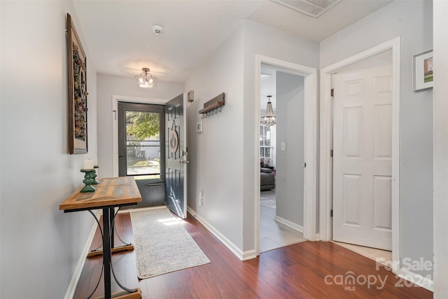 entryway with hardwood / wood-style floors