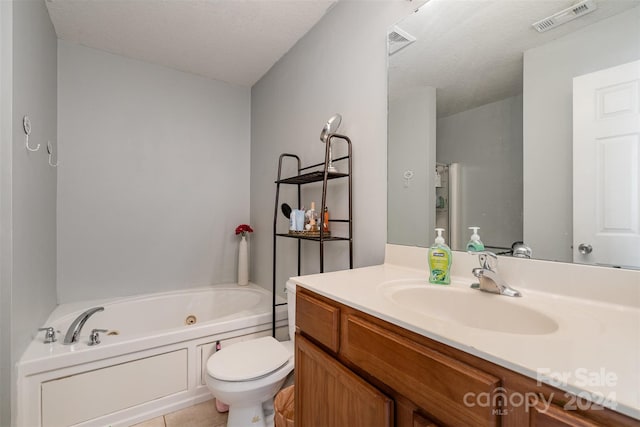 bathroom featuring tile patterned flooring, a bath, a textured ceiling, toilet, and vanity