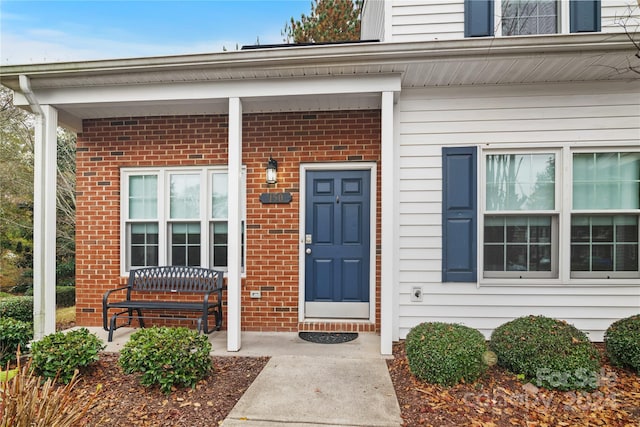 entrance to property featuring covered porch