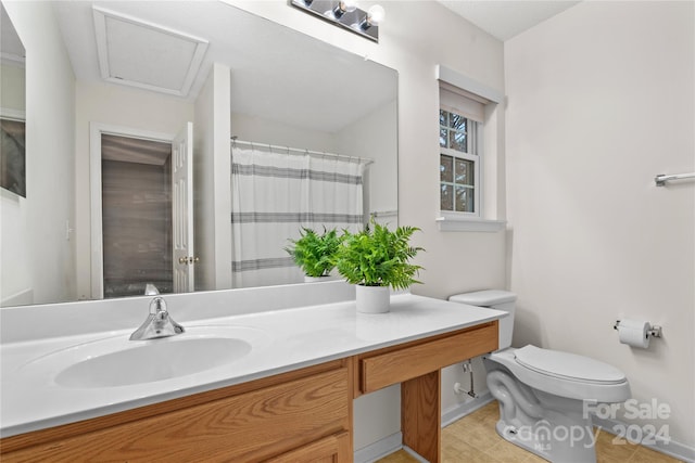 bathroom with tile patterned flooring, vanity, toilet, and a shower with shower curtain