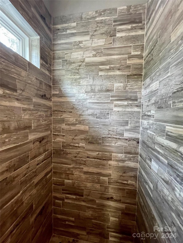 bathroom with tiled shower