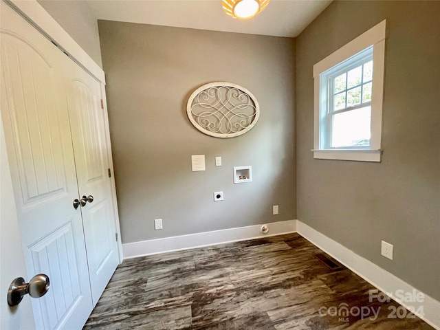 washroom featuring electric dryer hookup, dark hardwood / wood-style flooring, and washer hookup