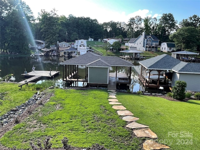 exterior space with a yard and a water view