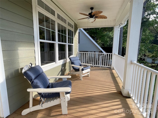 wooden deck with ceiling fan and a porch