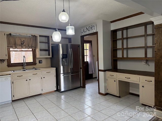 kitchen featuring hanging light fixtures, stainless steel refrigerator with ice dispenser, white dishwasher, and a wealth of natural light