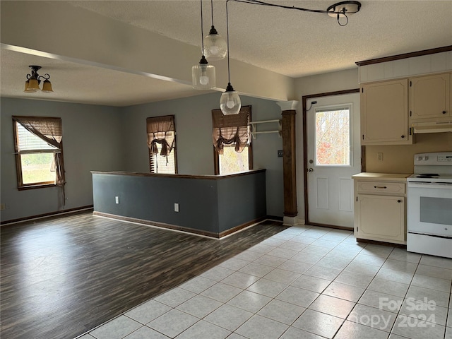 kitchen with decorative light fixtures, a textured ceiling, range hood, white electric range oven, and light hardwood / wood-style floors