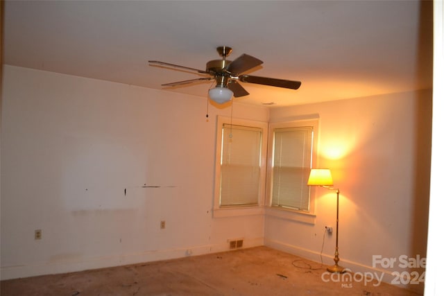 unfurnished room with ceiling fan