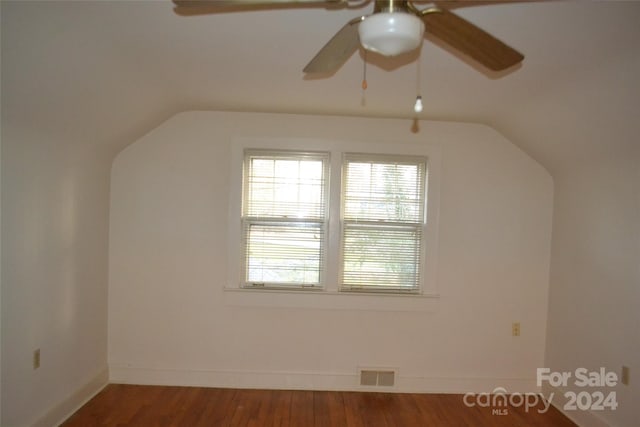 additional living space with hardwood / wood-style floors, ceiling fan, and lofted ceiling