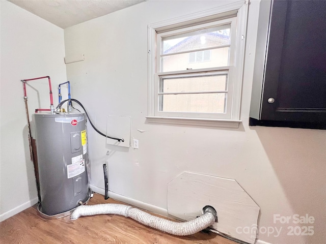 utility room featuring water heater