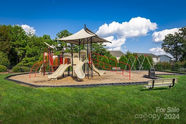 view of playground with a lawn