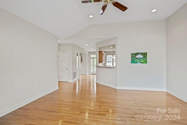 unfurnished living room featuring ceiling fan, light hardwood / wood-style flooring, and lofted ceiling