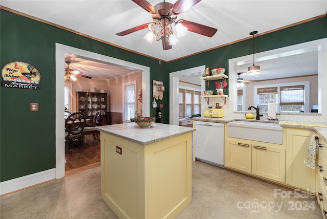 kitchen featuring dishwasher, a center island, a healthy amount of sunlight, and sink