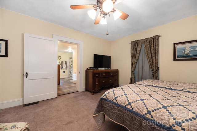 carpeted bedroom with ceiling fan