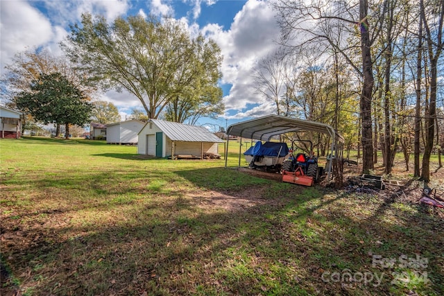 view of yard with an outdoor structure and a carport