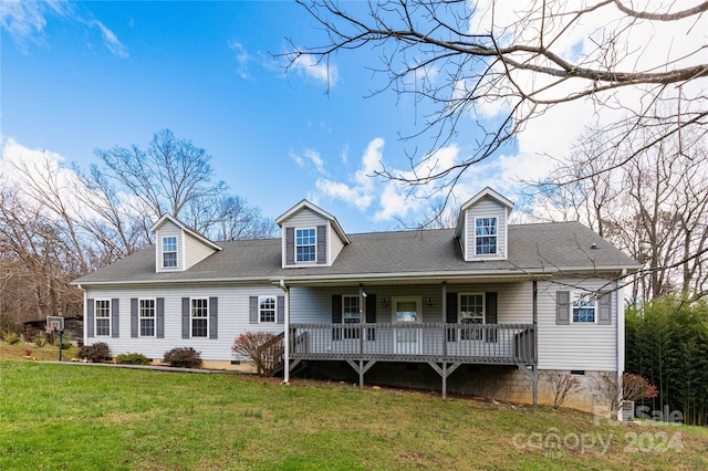 cape cod home with a front yard