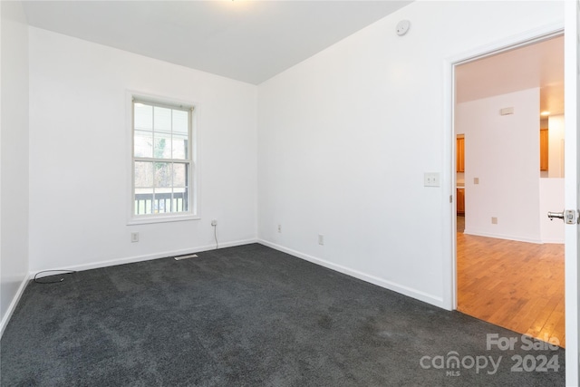 empty room featuring dark hardwood / wood-style floors