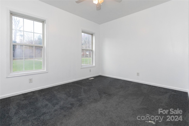 carpeted empty room with ceiling fan