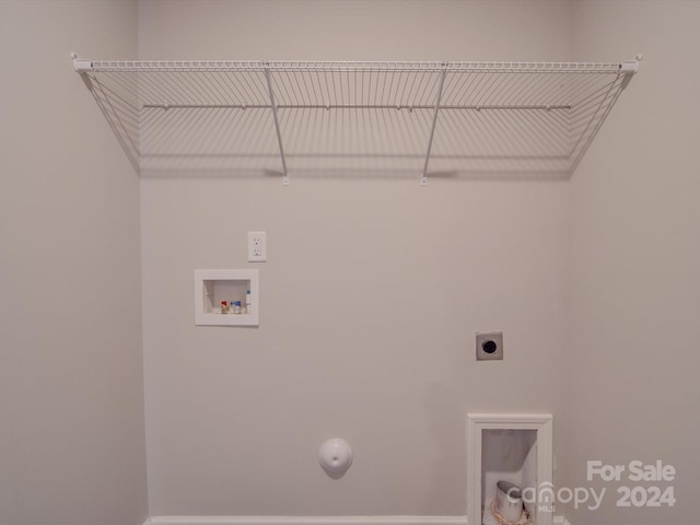 clothes washing area with hookup for a washing machine and hookup for an electric dryer