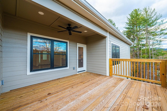 wooden deck featuring ceiling fan