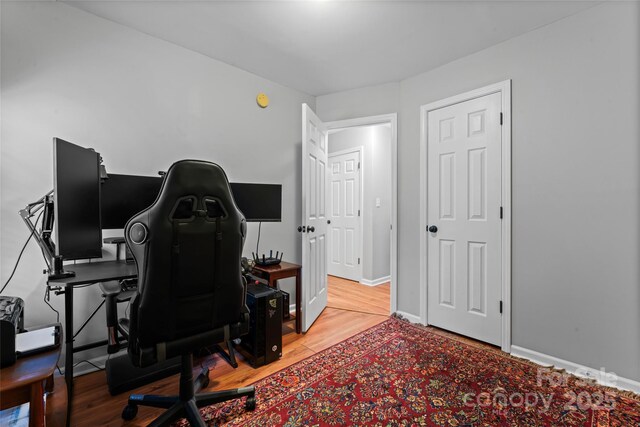 office featuring baseboards and wood finished floors