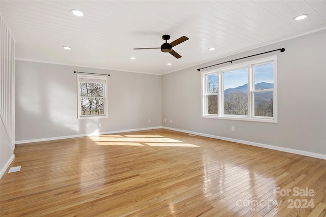 unfurnished room with ceiling fan, light hardwood / wood-style floors, and ornamental molding