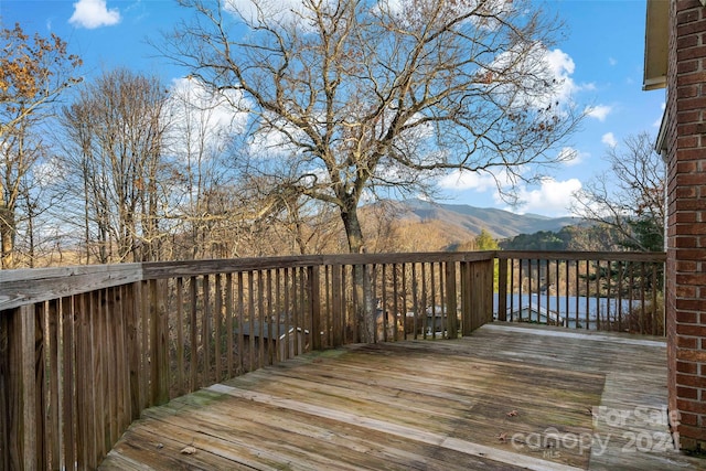 wooden terrace with a mountain view