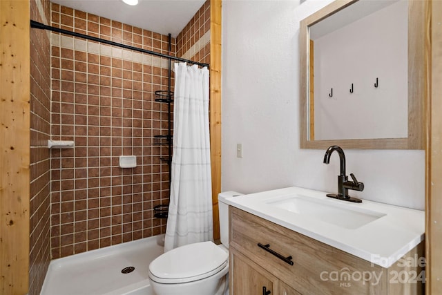 bathroom featuring a shower with curtain, vanity, and toilet