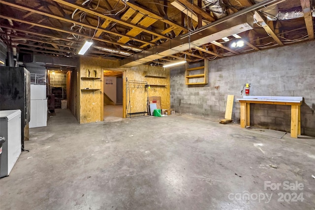 basement featuring white refrigerator