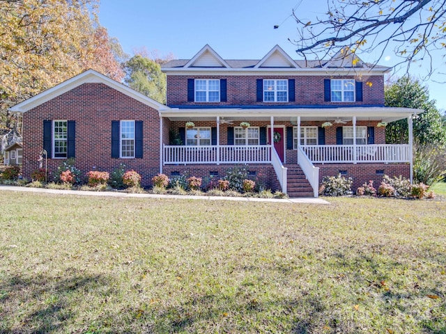 view of front of property featuring a front lawn and covered porch